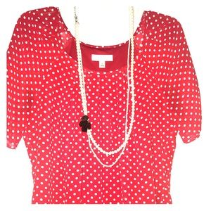 Red and white polka dot blouse